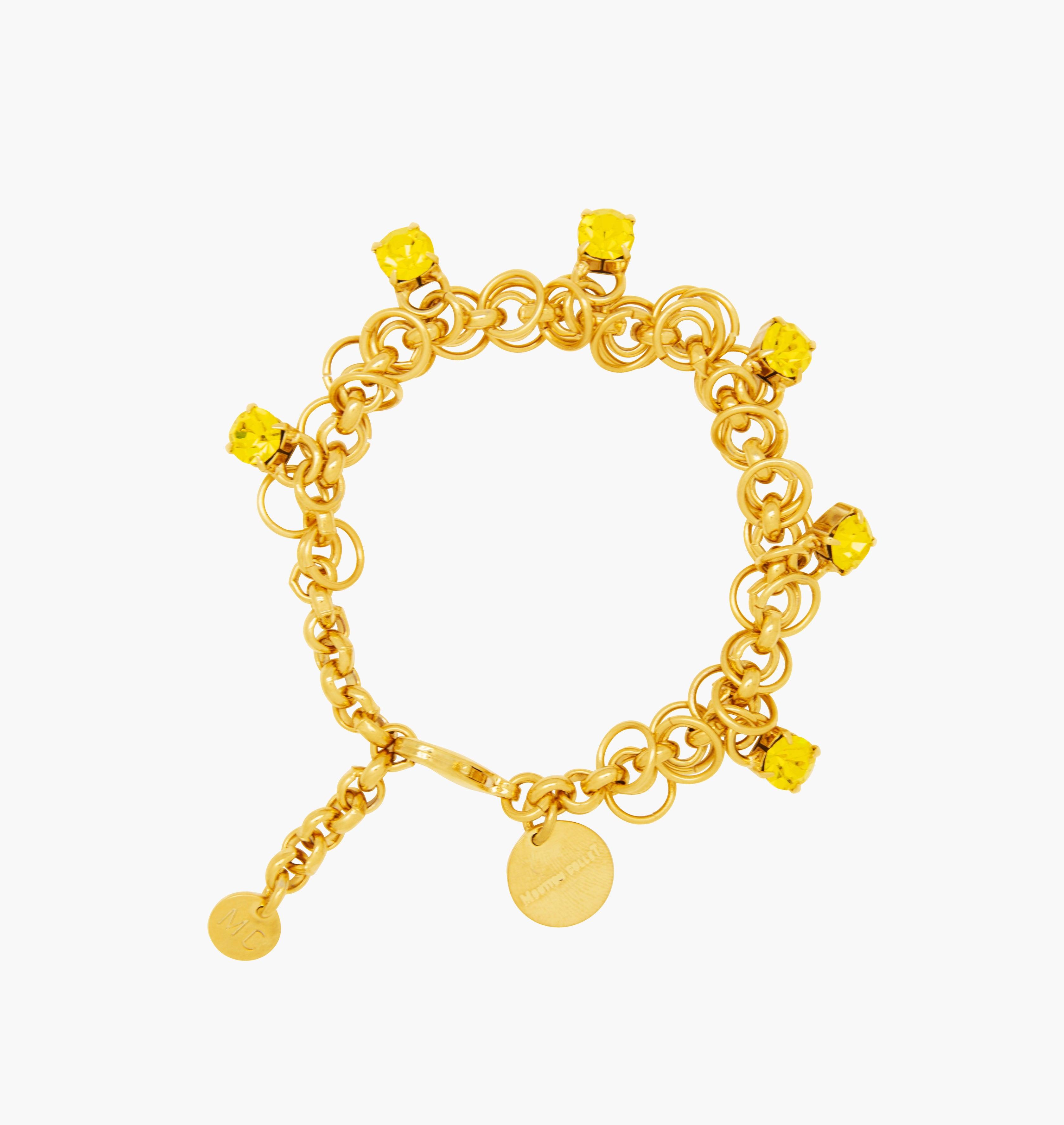 Bracelet STARS Citrine - shop.mouttoncollet.com, Moutton colleT, Notre bracelet STARS est réalisé en bronze dorées à l'or fin, serties de cristaux scintillants coloris jaune citrine avec de grands anneaux. Il est orné d'un médaillon gravé "Moutton colleT" et d'un petit logo gravé "MC". Il sera assez discret pour être associé à vos tenues du quotidien, strass cristal swarovski, moutton collet, bijoux jaune et or doré,