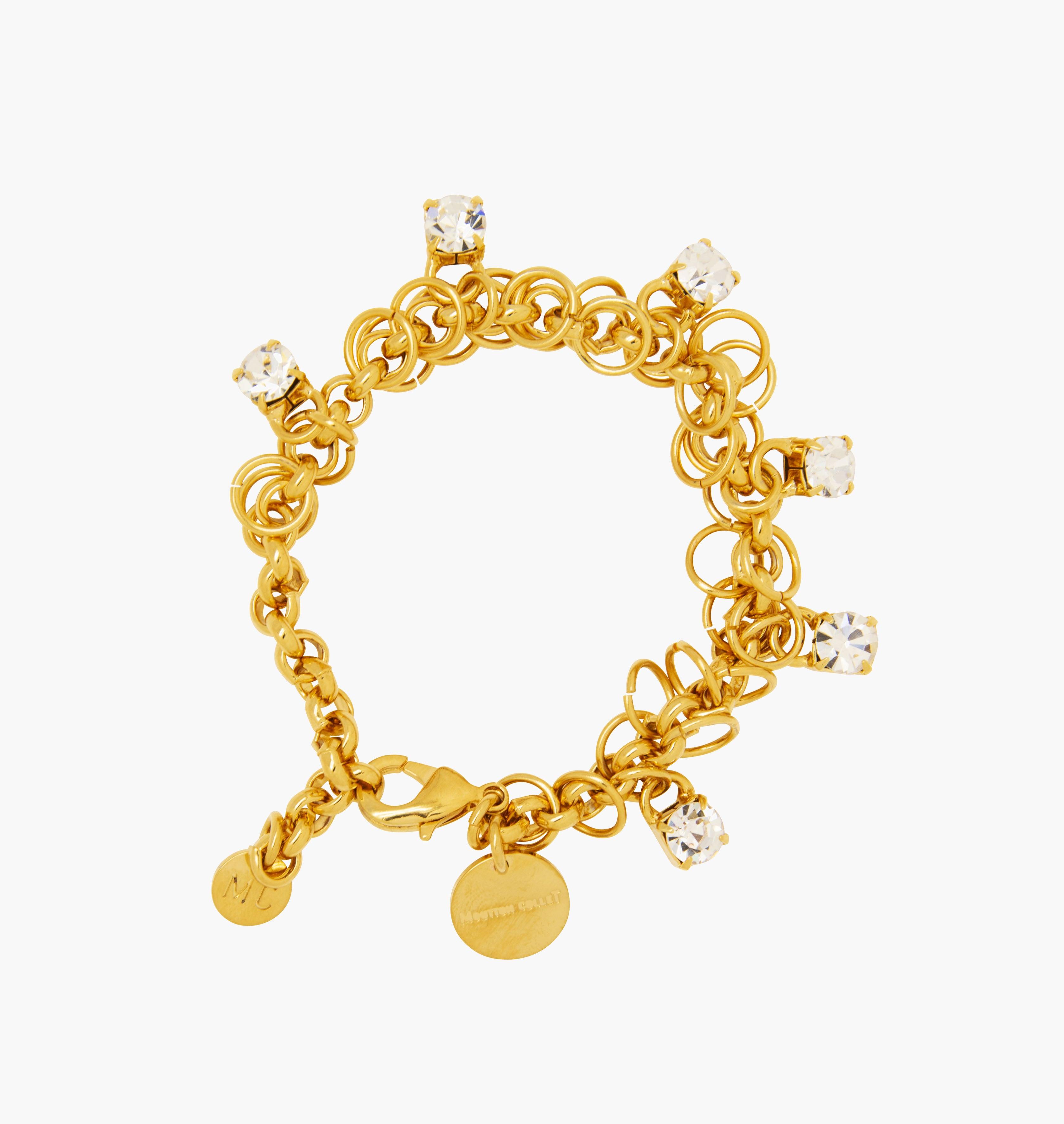 Bracelet STARS Crystal - shop.mouttoncollet.com, Moutton collet, Notre bracelet STARS est réalisé en bronze dorées à l'or fin, serties de cristaux scintillants coloris diamant avec de grands anneaux. Il est orné d'un médaillon gravé "Moutton colleT" et d'un petit logo gravé "MC". Il sera assez discret pour être associé à vos tenues du quotidien, strass cristal swarovski, bijou createur, bijoux vogue, bijoux fantaisie, bracelet strass brillant,