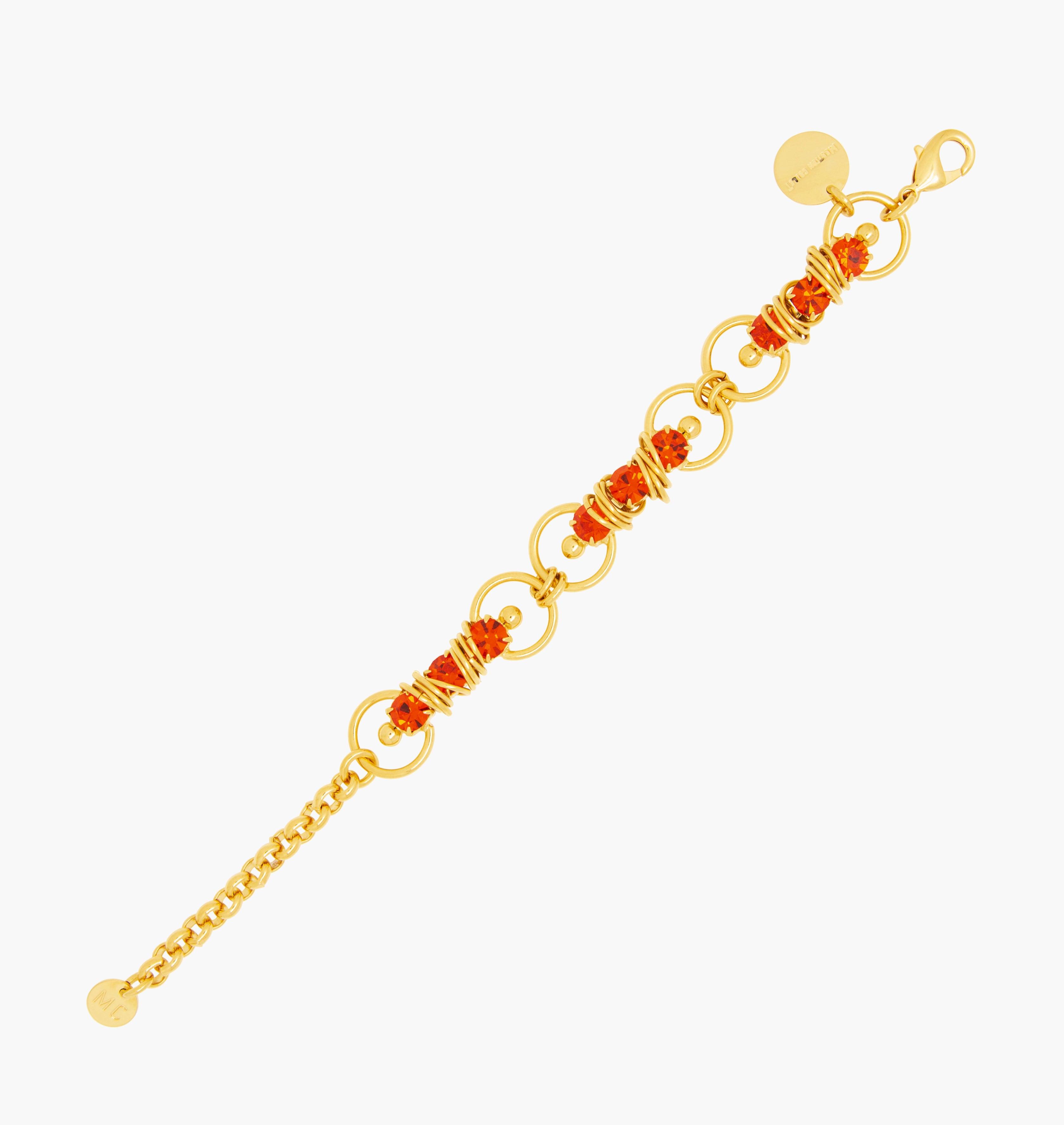 Bracelet MIXY Hyacinth - shop.mouttoncollet.com, Moutton colleT, Notre bracelet MIXY est réalisé en bronze dorées à l'or fin, serties de cristaux scintillants coloris hyacinth avec de grands et petits anneaux. Il est orné d'un médaillon gravé "Moutton colleT" et d'un petit logo gravé "MC", bijou fantaisie, bijou fait a la main, bijou createur, bijou strass swarovski,