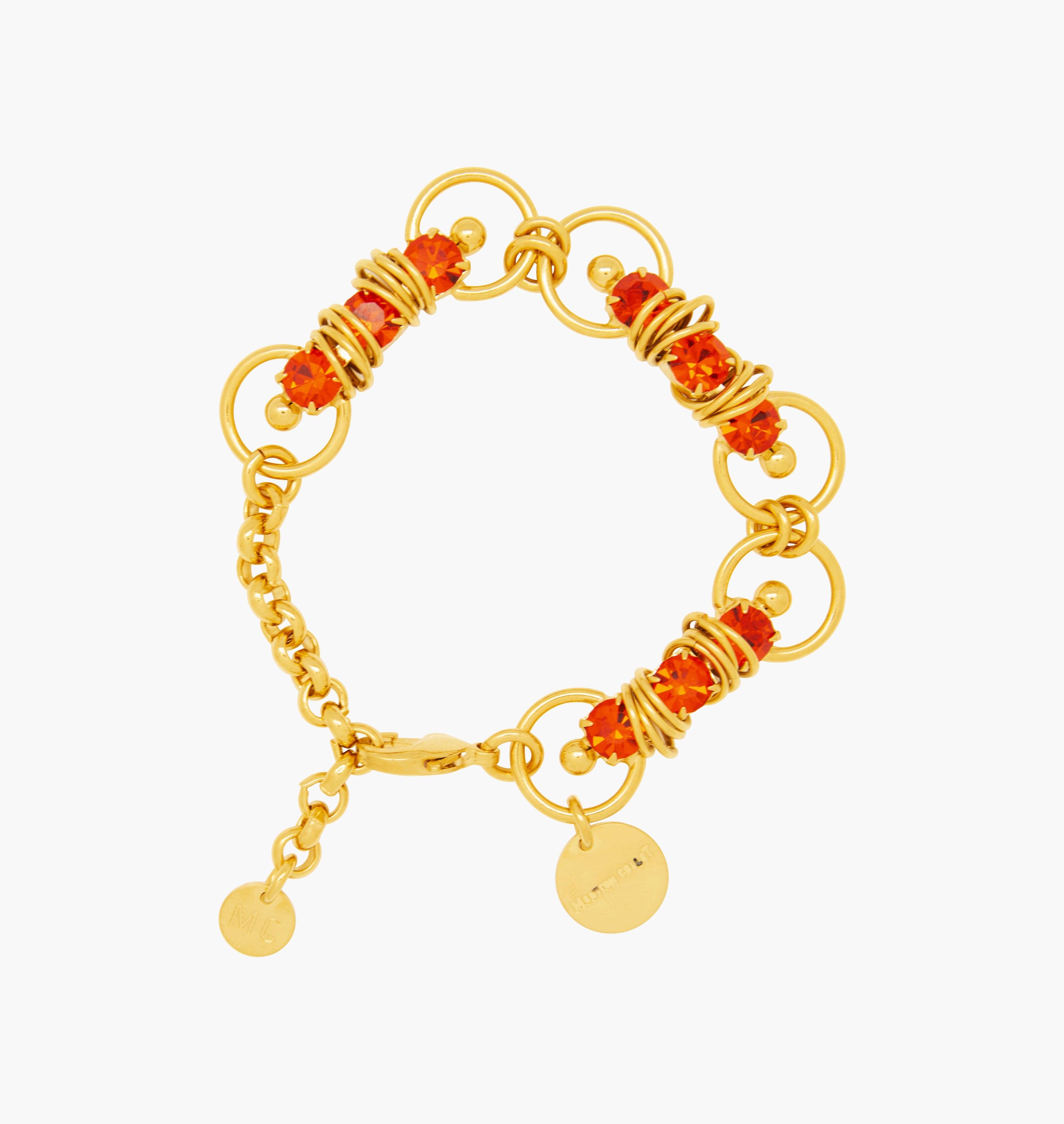 Bracelet MIXY Hyacinth - shop.mouttoncollet.com, Moutton colleT, Notre bracelet MIXY est réalisé en bronze dorées à l'or fin, serties de cristaux scintillants coloris hyacinth avec de grands et petits anneaux. Il est orné d'un médaillon gravé "Moutton colleT" et d'un petit logo gravé "MC", bijou fantaisie, bijou fait a la main, bijou createur, bijou strass swarovski,