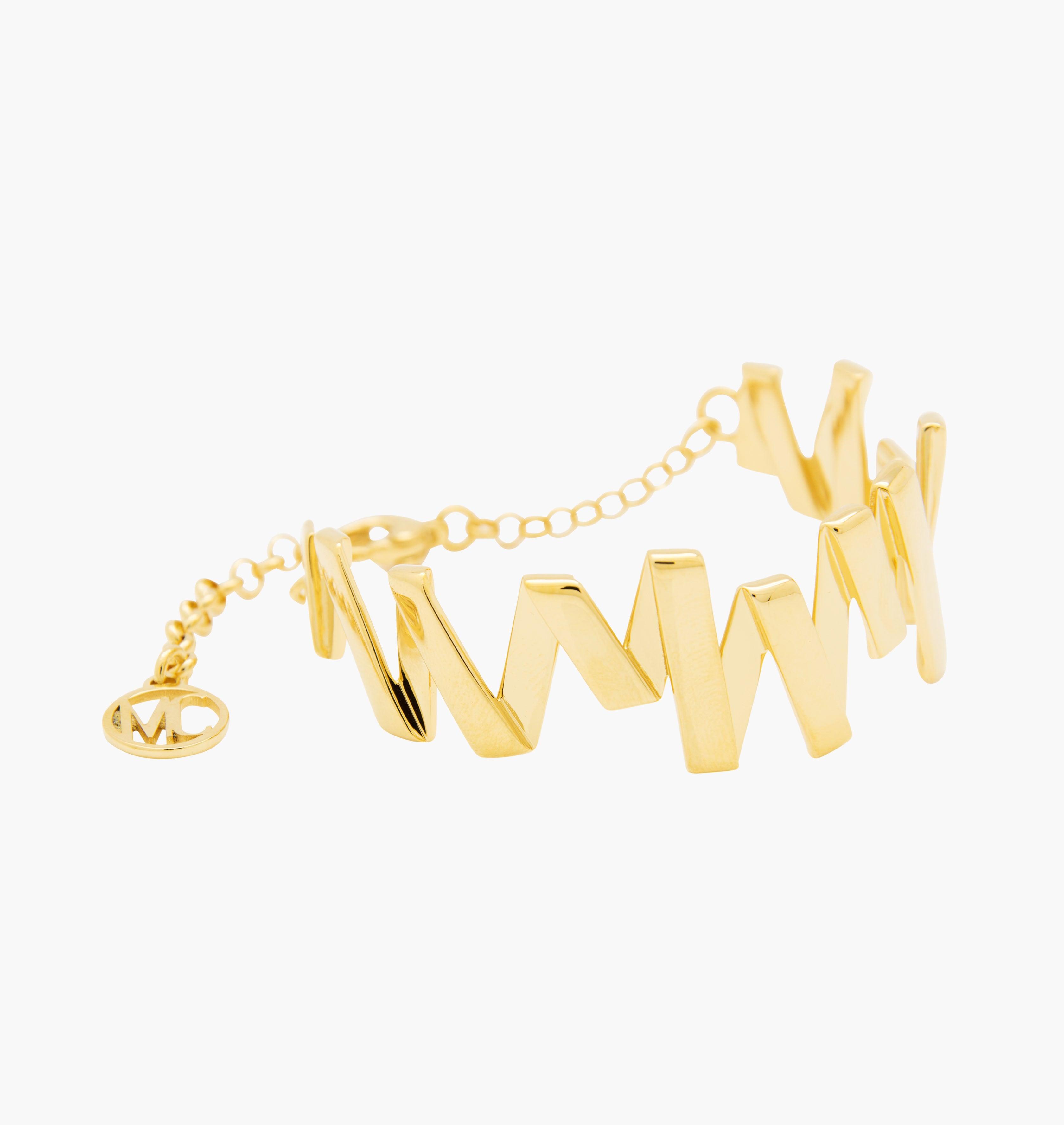 Moutton colleT Notre bracelet VIBRATIONS est réalisé en bronze doré à l'or fin. Il est orné d'un petit logo "MC". Il habillera votre poignet avec une touche fun et chic, pour un look modern et peps.bijoux doré or, bijoux créateurs fabriqué made in Belgium , bracelet originale, bracelet or doré, zig zag, éclair , bracelet année80